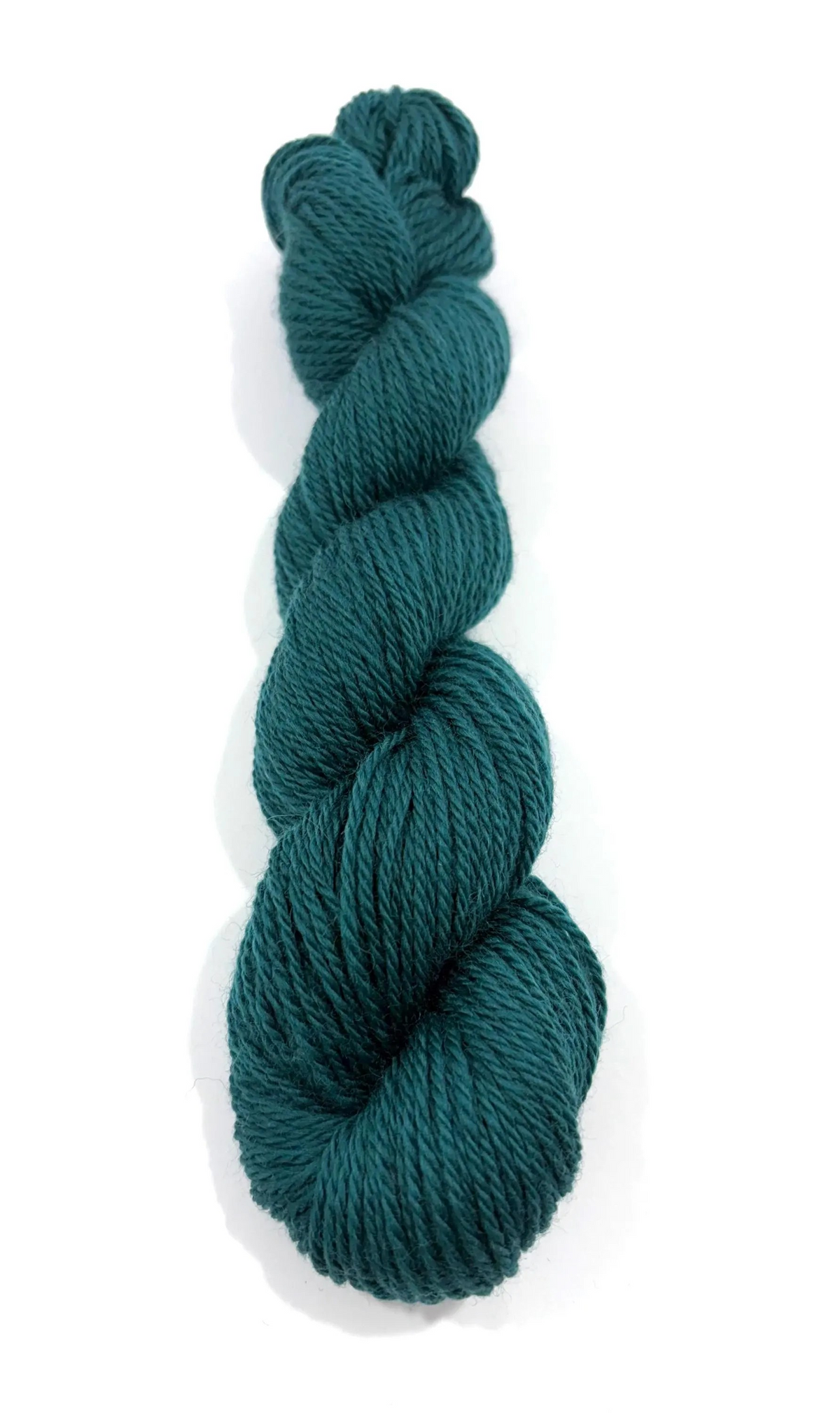 A single skein of dark teal yarn standing vertically on a plain white background.