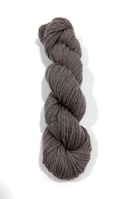 A single skein of twisted yarn in a muted taupe-brown color, photographed vertically against a clean white background.