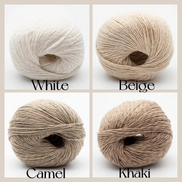 Four balls of yarn arranged in a 2x2 grid with labels underneath: White, Beige, Camel, and Khaki. Each ball is shown against a light background with its name printed below.