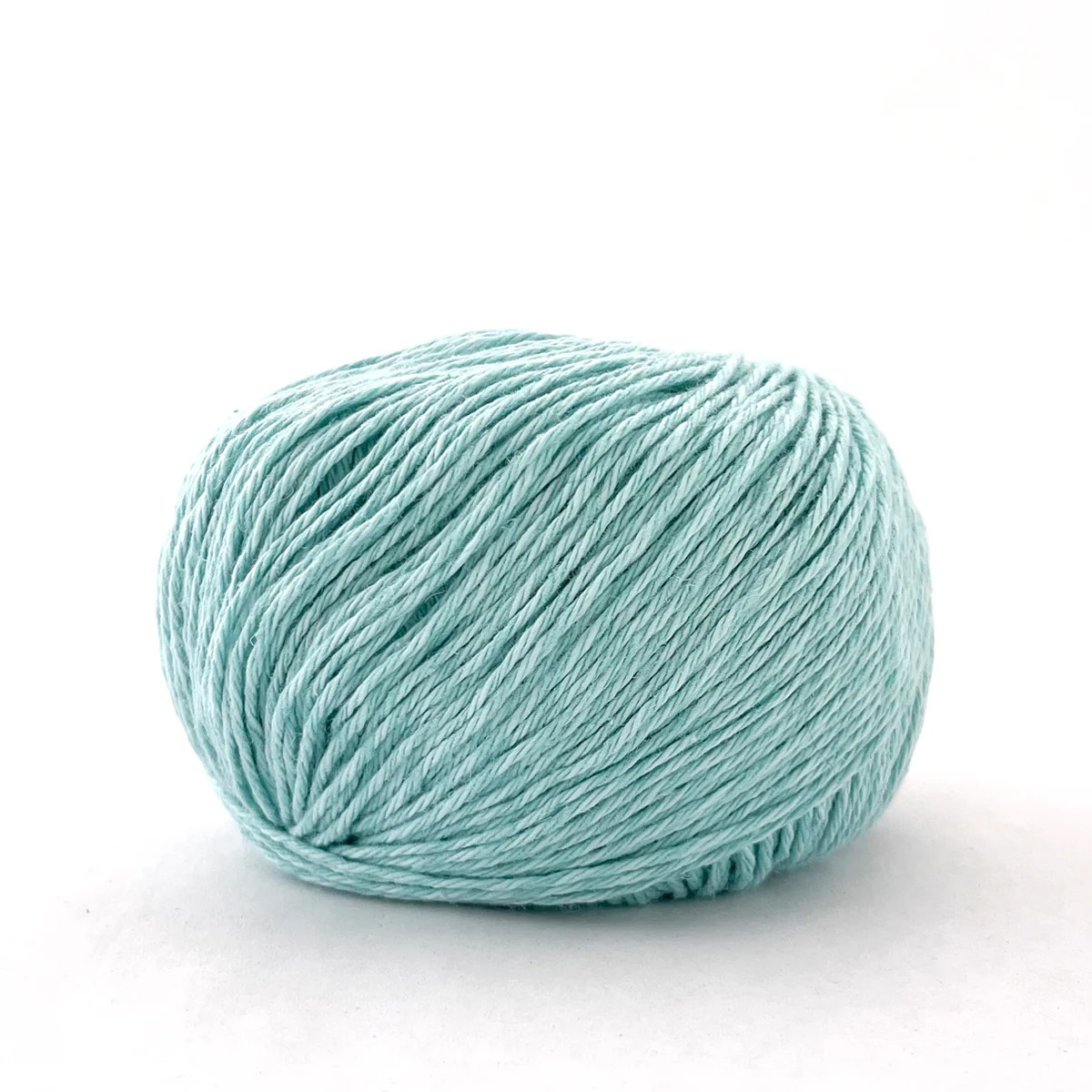 A ball of light mint green yarn on a clean white background.