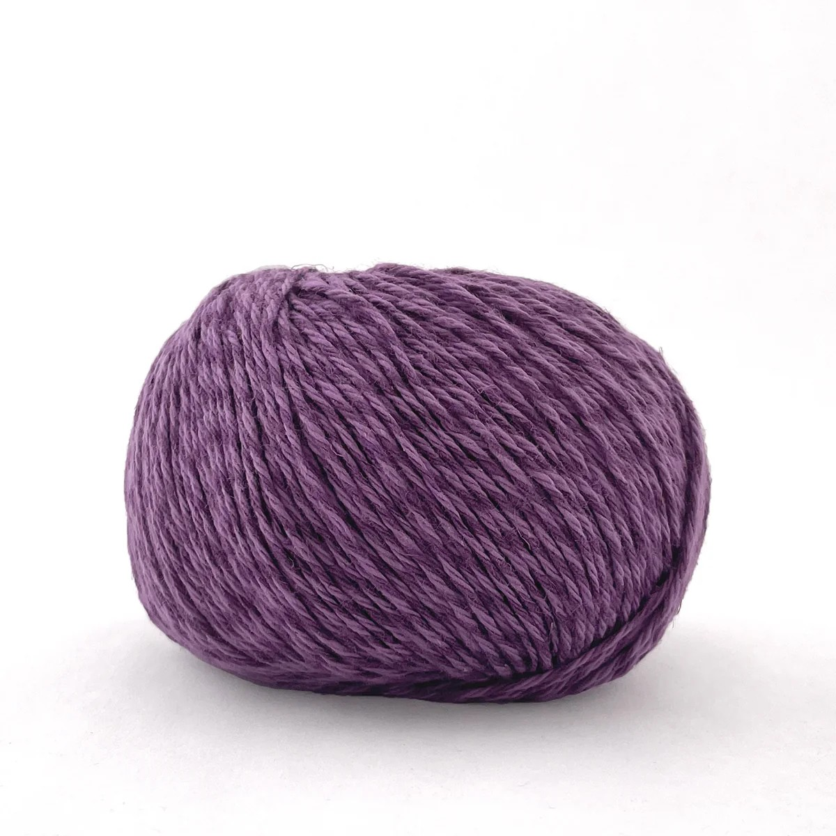 A single ball of textured purple yarn photographed on a clean white background.