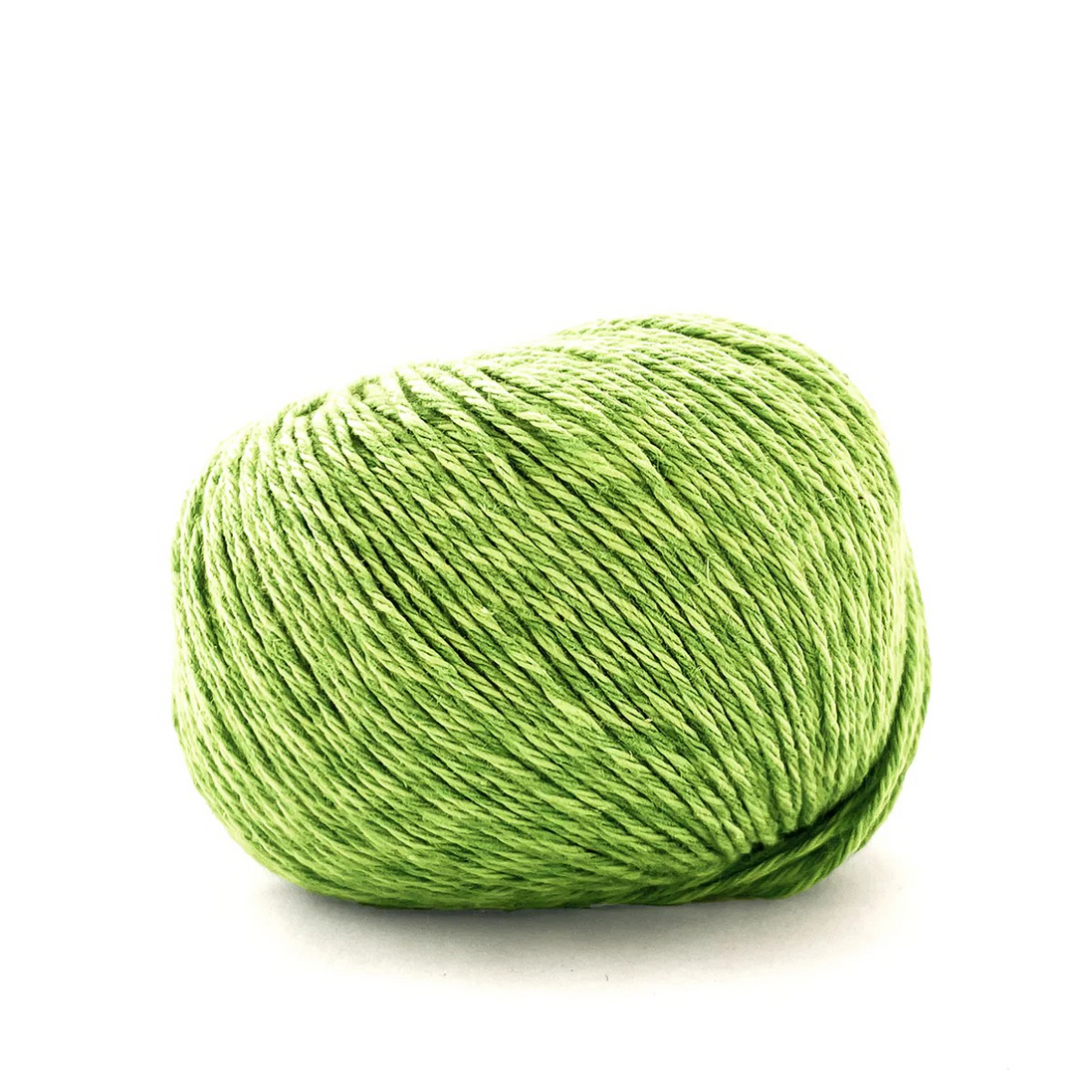 Green skein of yarn on a white background