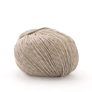A single ball of light beige yarn photographed on a clean white background.