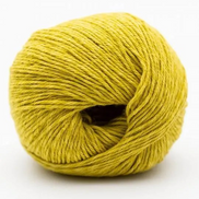 A ball of mustard yellow yarn photographed on a clean white background.