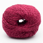 Ball of pink yarn on a white background