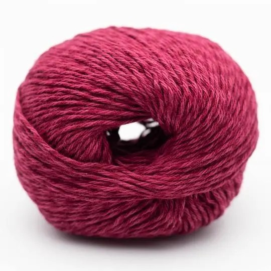Ball of pink yarn on a white background