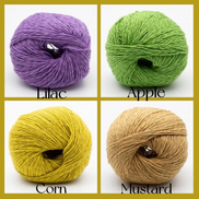 Four balls of yarn arranged in a 2x2 grid with labels underneath: lilac, apple, corn, and mustard. The yarn balls are shown on a white background with a mustard border around the image.