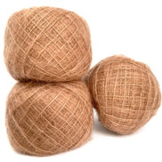 Three balls of natural jute twine in a warm tan-brown color, arranged on a plain white background.