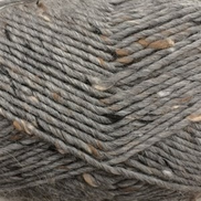 Close-up of a gray yarn skein with small natural brown and white inclusions woven throughout.