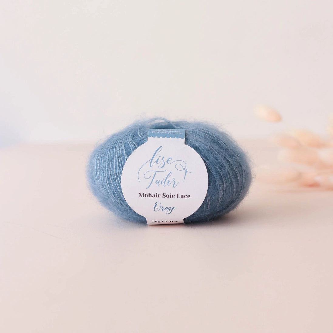 Blue skein of yarn with a label on a light background