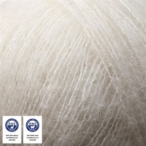 Close-up of fluffy off-white or cream-colored hair fibers, likely a wig or hair extension sample, with two certification badges in the bottom-left corner.