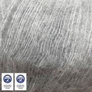 A close-up of light gray to silver-colored curly hair or fiber texture, with two small certification badges in the bottom-left corner.