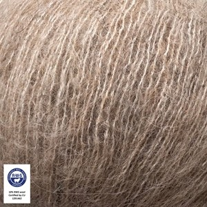 A close-up of fluffy, textured yarn in a warm taupe-brown color, with a small certification label in the bottom-left corner.