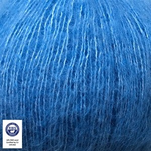 Close-up of blue yarn with a RWS label indicating wool content.