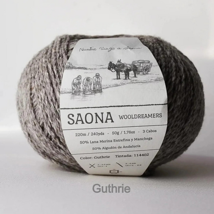 A ball of gray wool yarn with a white paper label reading 'SAONA WOODREAMERS' and 'Color: Guthrie', photographed on a light gray background.