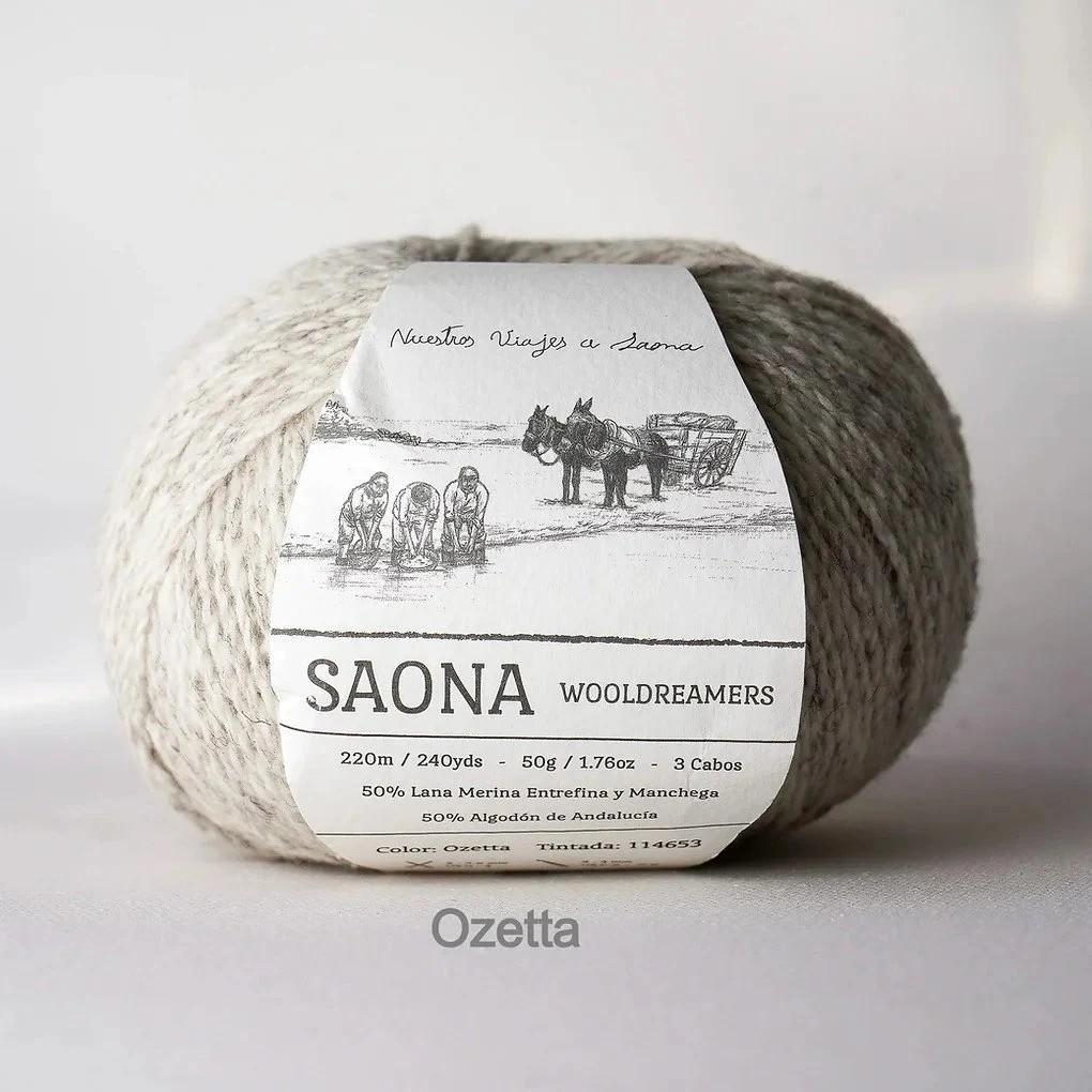 A ball of wool yarn with a white paper label reading 'SAONA WOODREAMERS' and 'Ozetta' at the bottom, photographed against a plain light background.