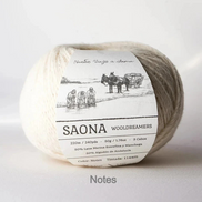 A ball of wool yarn with a paper label reading 'SAONA WOODREAMERS' and 'Notes' printed below, photographed on a clean white background.