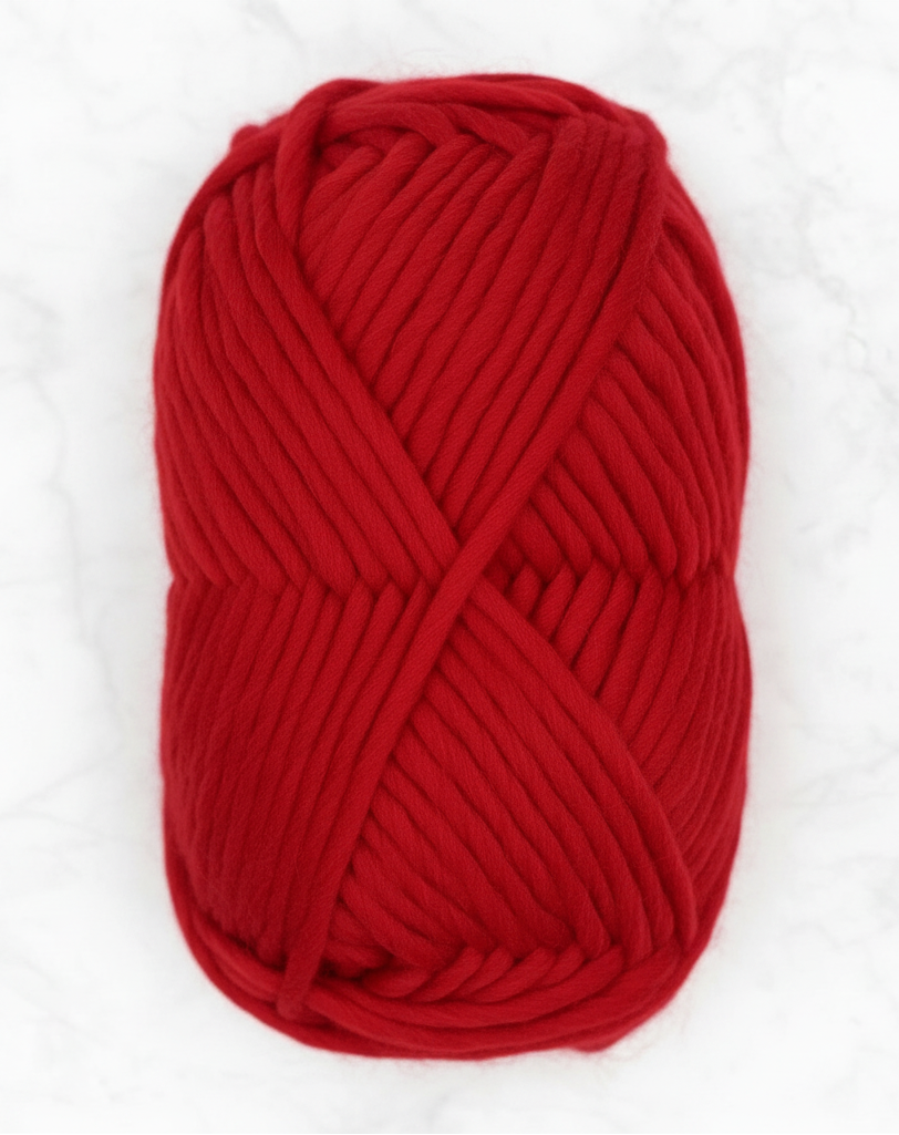 Bulky Weight Yarn 100% Merino Wool Super Bulky Yarn Weight 6 Chunky Natural Wool Yarn for Knitting & Crochet Quick Project Yarn. A skein of chunky red yarn wrapped in a white and red paper label that reads 'World of Wool Chubbs Super Chunky 100% Merino Yarn' on a white marble surface.