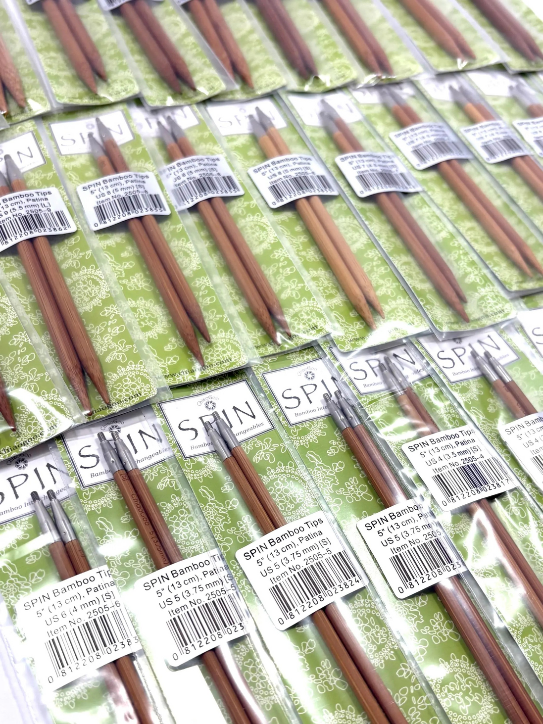 5" Wooden Knitting Needles 13 cm Chiaogoo Bamboo Needle TIPS SPIN Interchangeable Needle All Sizes US3 4 5 6 7 8 9 10 10.5 11 for Red Lace Cable Smooth Knitting Lightweight. Packaged knitting needles arranged in rows on a light green patterned background. Each pair is in clear plastic packaging with a white label reading SPIN and product details including 'SPIN Bamboo Top 5" (12.