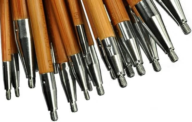5" Wooden Knitting Needles 13 cm Chiaogoo Bamboo Needle TIPS SPIN Interchangeable Needle All Sizes US3 4 5 6 7 8 9 10 10.5 11 for Red Lace Cable Smooth Knitting Lightweight. A close-up of multiple wooden knitting needles with silver metal tips arranged diagonally on a plain white background.